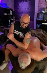 a man is getting a massage in a massage room