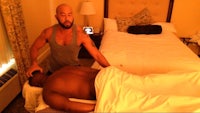 a man getting a massage in a hotel room